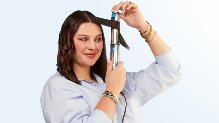 woman using a babylisspro hair straightener