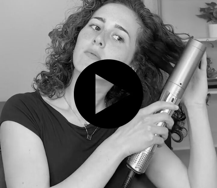 woman with long hair using the style switch adjustable concentrator to dry her wet hair